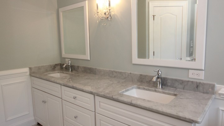 Raleigh master bath featuring white cabinets